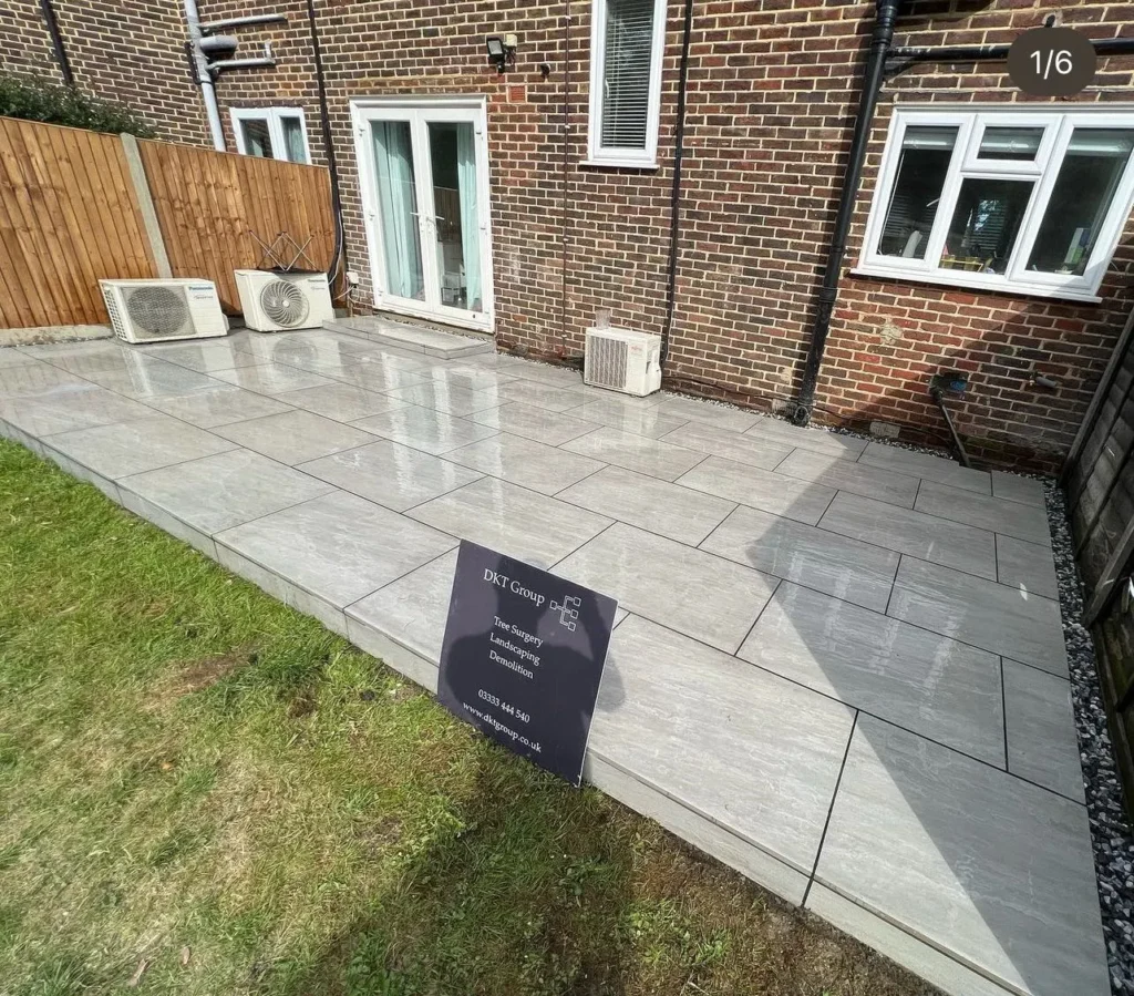 Large porcelain patio laid at the back of a house